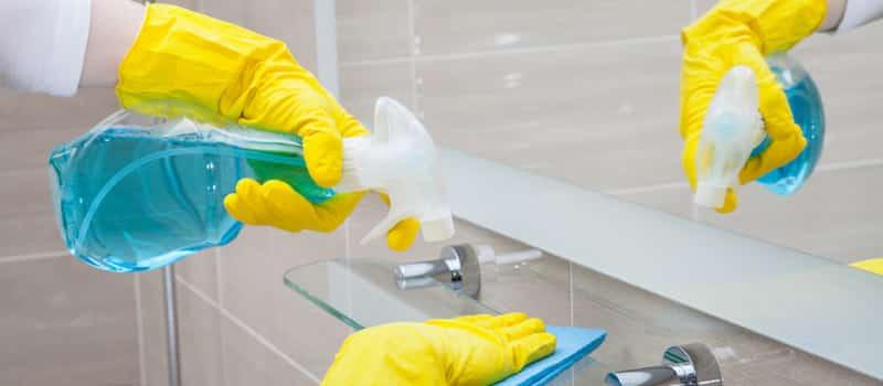 Support worker cleaning a kitchen